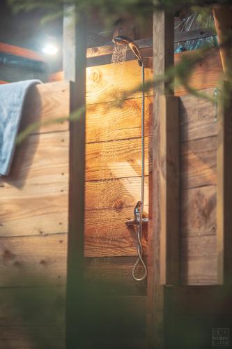 a close up of a wooden door with a hook at Domaine de la Vitarelle Glamping in Villanière