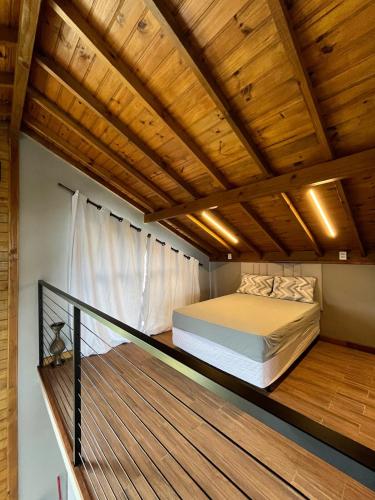 Ένα ή περισσότερα κρεβάτια σε δωμάτιο στο Casa Hortênsia - Beira da Lagoa - Laguna-SC