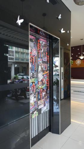 a glass door in a building with stickers on it at Century Hotel in Kaohsiung