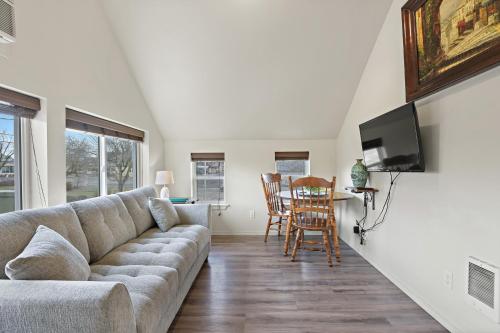 a living room with a couch and a table at Maple Leaf Manor Suites in Spokane