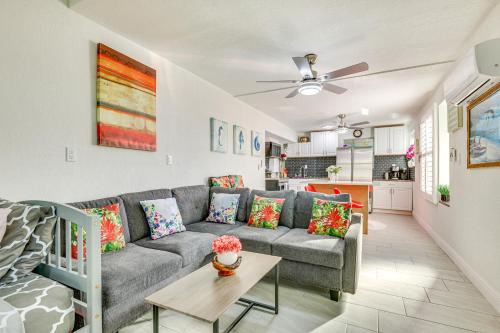 a living room with a couch and a table at Driftwood Beach Suite - Walk to Clearwater Bch in Clearwater Beach