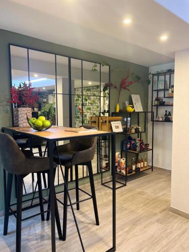 a dining room with a table and some chairs at SOFI-LIVING-APARTMENTS in Hannover