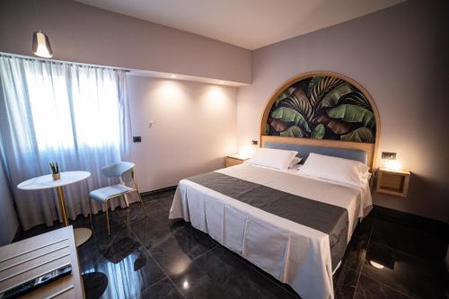 Ένα ή περισσότερα κρεβάτια σε δωμάτιο στο Ingrid Rooms Tropea