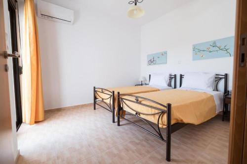Postel nebo postele na pokoji v ubytování Twins Villas Irini & Vasiliki