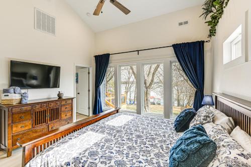 a living room with a couch and a tv at Fish, Boat and Unwind Old Hickory Lake Retreat in Nonaville