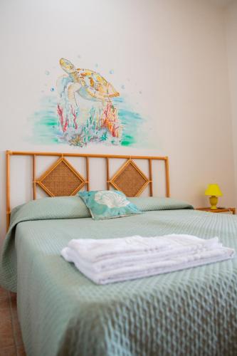 Una cama o camas en una habitación de Falco in Pietra