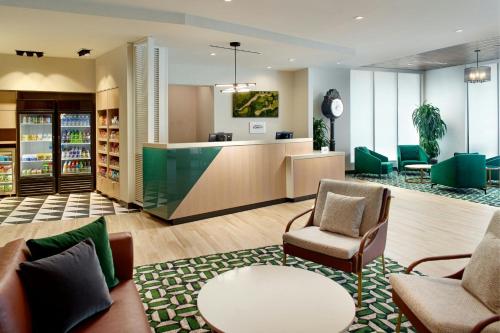 a lobby of a store with chairs and a counter at Fairfield by Marriott Inn & Suites Grovetown in Grovetown
