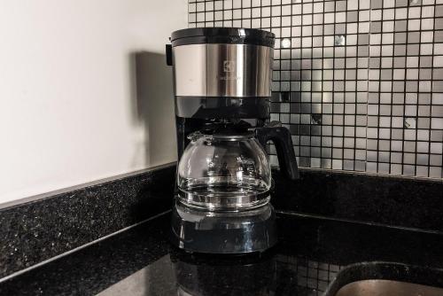 a coffee pot sitting on top of a counter at ON Paraiso in Sao Paulo