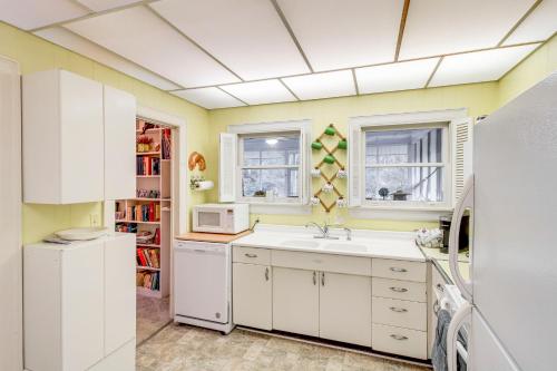 a kitchen with a sink and a microwave at Central and Ornate Sewanee Home with Screened-In Porch in Sewanee
