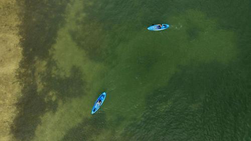 two boats in the water in the ocean at Paradise Reef Villas in French Harbour