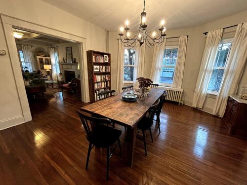 a dining room with a wooden table and chairs at The Farmhouse at Fort Hill in Peekskill
