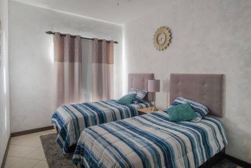 Ένα ή περισσότερα κρεβάτια σε δωμάτιο στο Rosarito Ocean View Home