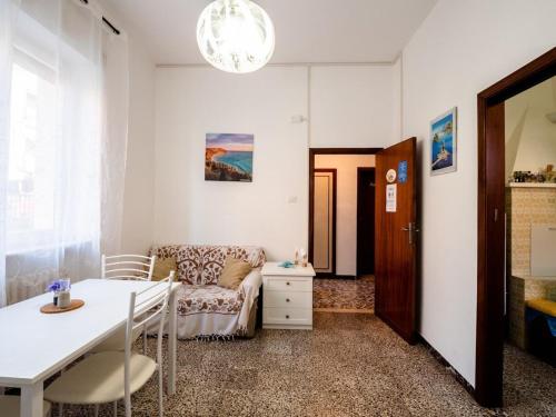 a living room with a couch and a table at CASA MAFALDA - Rooms, friends and more - Affittacamere, Guest House in Senigallia