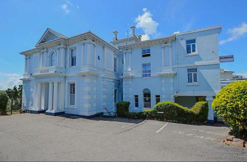 a large white house with at Allerdale in Torquay