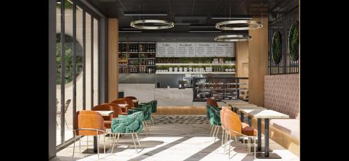 a restaurant with tables and chairs and a bar at Pana Green Residence in Panagyurishte