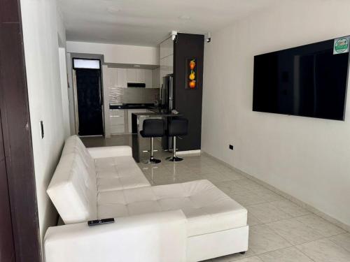 TV a/nebo společenská místnost v ubytování Casa con todas las comodidades en prados del este