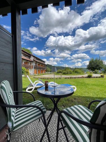 a table and chairs on a porch with a view at Apartment in Obernzell in Obernzell