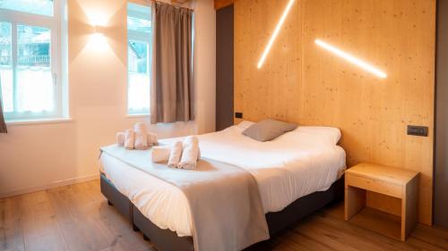 Postel nebo postele na pokoji v ubytování Appartamento Vale e Schena Cortina D'Ampezzo