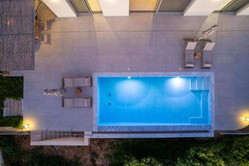 an overhead view of a large swimming pool at Villa Armeno in Vlachata