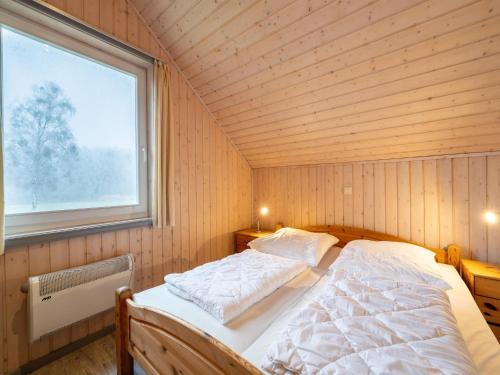 Katil atau katil-katil dalam bilik di tolles Ferienhaus für Familien