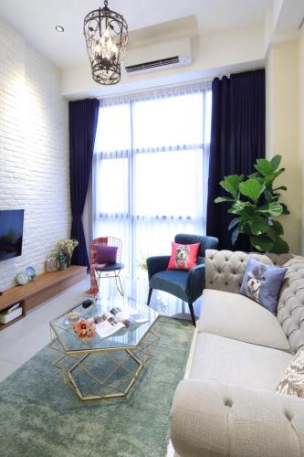 a living room with a couch and a table at BV Taipei Da'an C&D in Taipei
