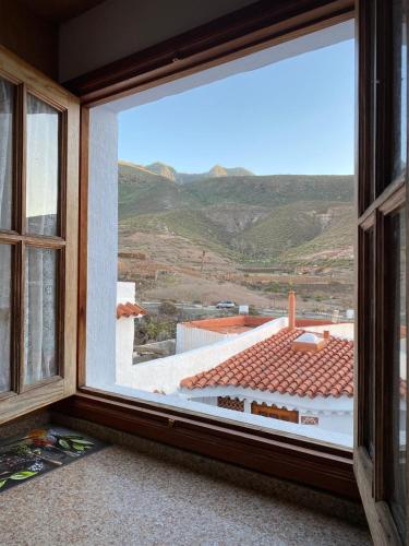 a window with a view of a mountain at Casa Salvador in Agaete