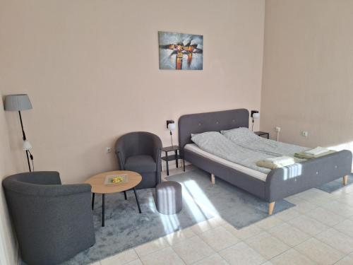 Postel nebo postele na pokoji v ubytování MainStreet apartman