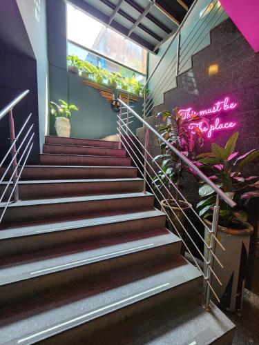 a set of stairs in a building with plants at Socialtel Parque 93 Bogota in Bogotá