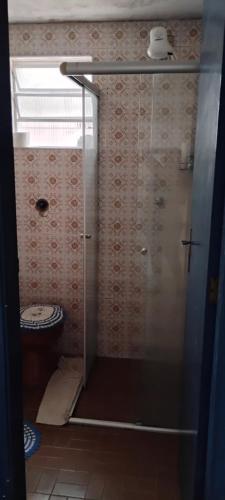 a shower with a glass door in a bathroom at Cantinho do sonho in São Sebastião