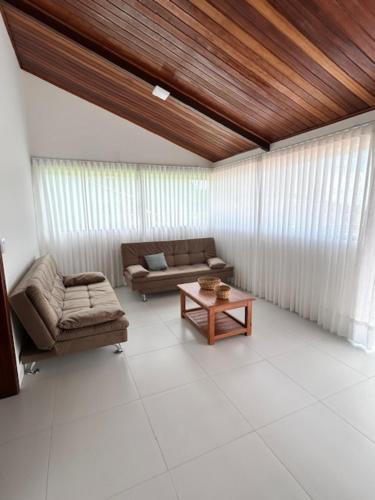 a living room with a couch and a coffee table at vila sua casa 2 in Santo André