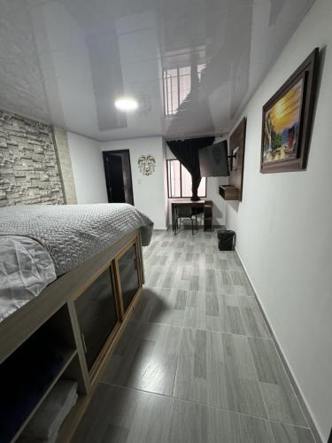 Una cama o camas en una habitación de Hotel Canela 96