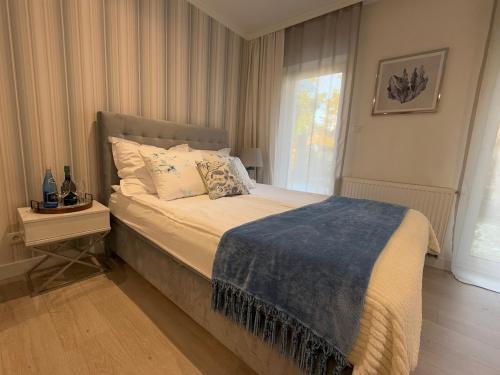 Ένα ή περισσότερα κρεβάτια σε δωμάτιο στο Baltic Residence nr 5