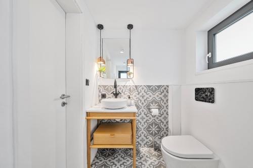 a bathroom with a toilet and a sink at Ankerplatz SPO 2 in Böhl