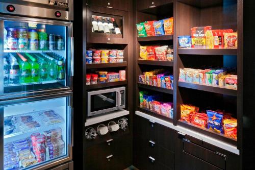 a refrigerator filled with lots of food and drinks at Courtyard by Marriott San Diego Carlsbad in Carlsbad