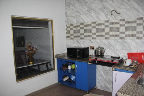 a small kitchen with a counter and a sink at London touch great 2bedroom with free WiFi 24hr light N65,000 in Port Harcourt