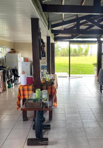 a kitchen with a table with food on it at El Campo - Cabaña 2 in Gualeguaychú