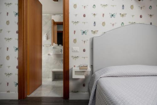 Postel nebo postele na pokoji v ubytování Maxxim Hotel & Loft