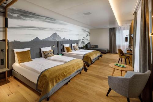 Postel nebo postele na pokoji v ubytování Hotel Allegra Lodge