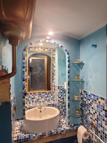 a bathroom with a sink and a mirror at Alloggio turistico Giulia in Albano Laziale
