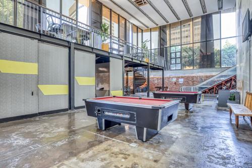 a room with two pool tables in a building at COGE - Braamfontein - 2 Bedroom in Johannesburg