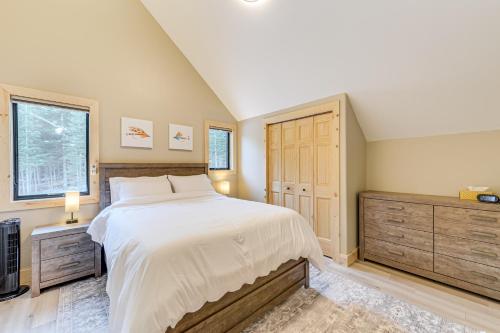 a bedroom with a large bed and a television at Views, Trails, Hot Tub and More Luxe Wyoming Oasis in Dubois
