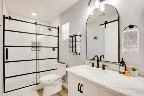 a bathroom with a toilet and a sink and a mirror at Less Than 1 Mi to Lake Fork Appy Haven in Yantis in Yantis