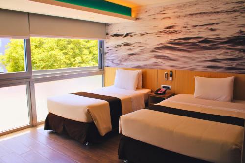 Postel nebo postele na pokoji v ubytování Palmetto Hotel Business San Borja