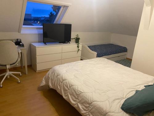 Postel nebo postele na pokoji v ubytování Studio well equipped in Kirchberg for families