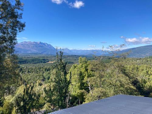 a view of the mountains from the roof of a house at Las Morillas in El Bolsón