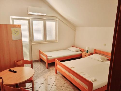 Postel nebo postele na pokoji v ubytování Apartment Vido