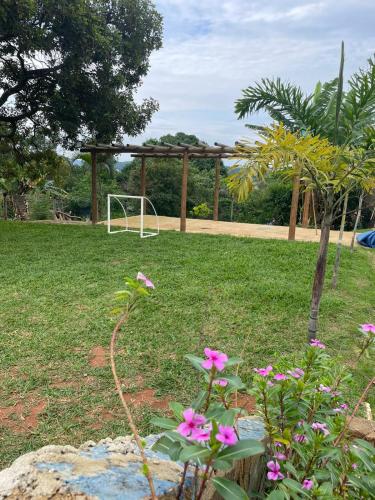 a gazebo with a soccer goal in a field at Sítio Oásis in Esmeraldas