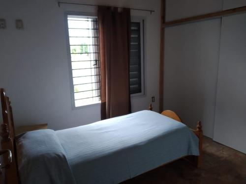 Ένα ή περισσότερα κρεβάτια σε δωμάτιο στο Casa Benielli