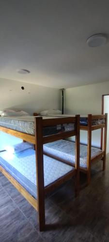 a room with two bunk beds in a room at Casa in San Clemente del Tuyú