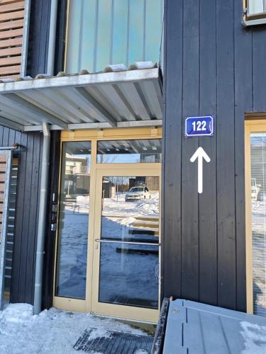 an entrance to a building with a sign on it at Apartmán SOVA - Klínovec in Loučná pod Klínovcem